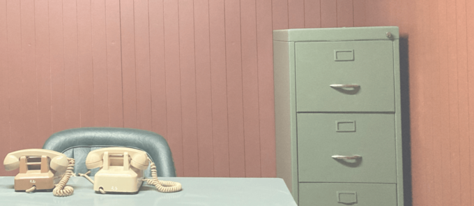 An old filing cabinet with two rotary-dial telephones on a desk. Lucy actually took this photo! At Saigon's Independence Palace.